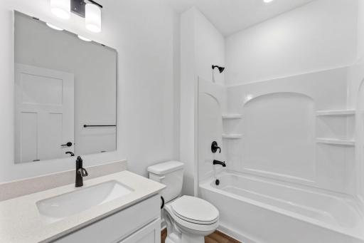 This shared full bathroom is easily accessible from the open floorplan for guest and daytime use.