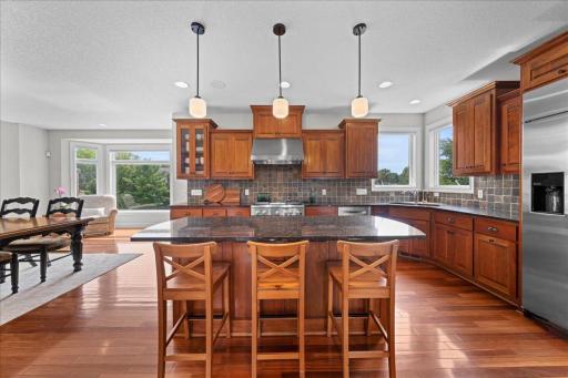 Breakfast island with granite countertops.