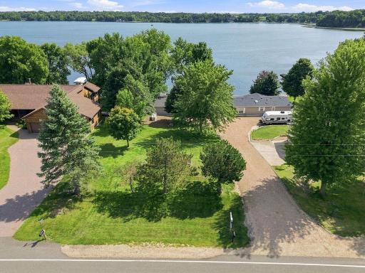 Lovely Established Landscaping and Trees; the seller has enjoyed summers here since 1967. There is street parking in addition to parking next to the home.