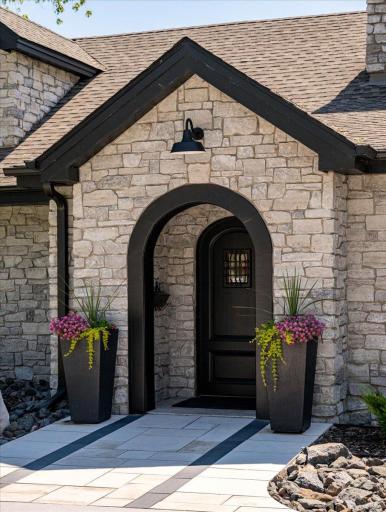 Clad entirely in natural stone, the home feels intrinsically connected to its North Shore setting—substantial, timeless and built to belong here.