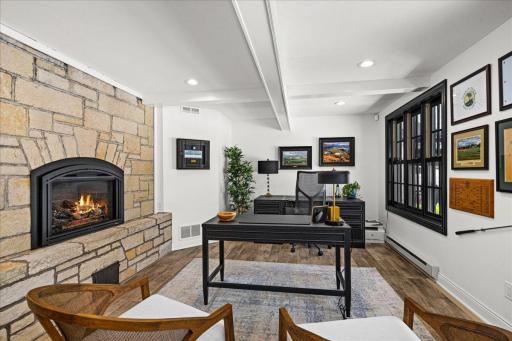A refined private office tucked discreetly at the front of the home, thoughtfully positioned to overlook the expansive setback grounds while maintaining a sense of separation.