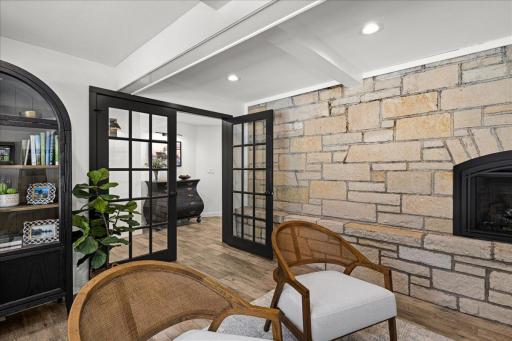 The original stone fireplace has been beautifully preserved and updated with the convenience of gas, while French doors allow the office space to transition effortlessly from open to private.