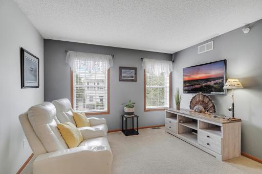 The upper level loft provides more living space for relaxing or a home office.