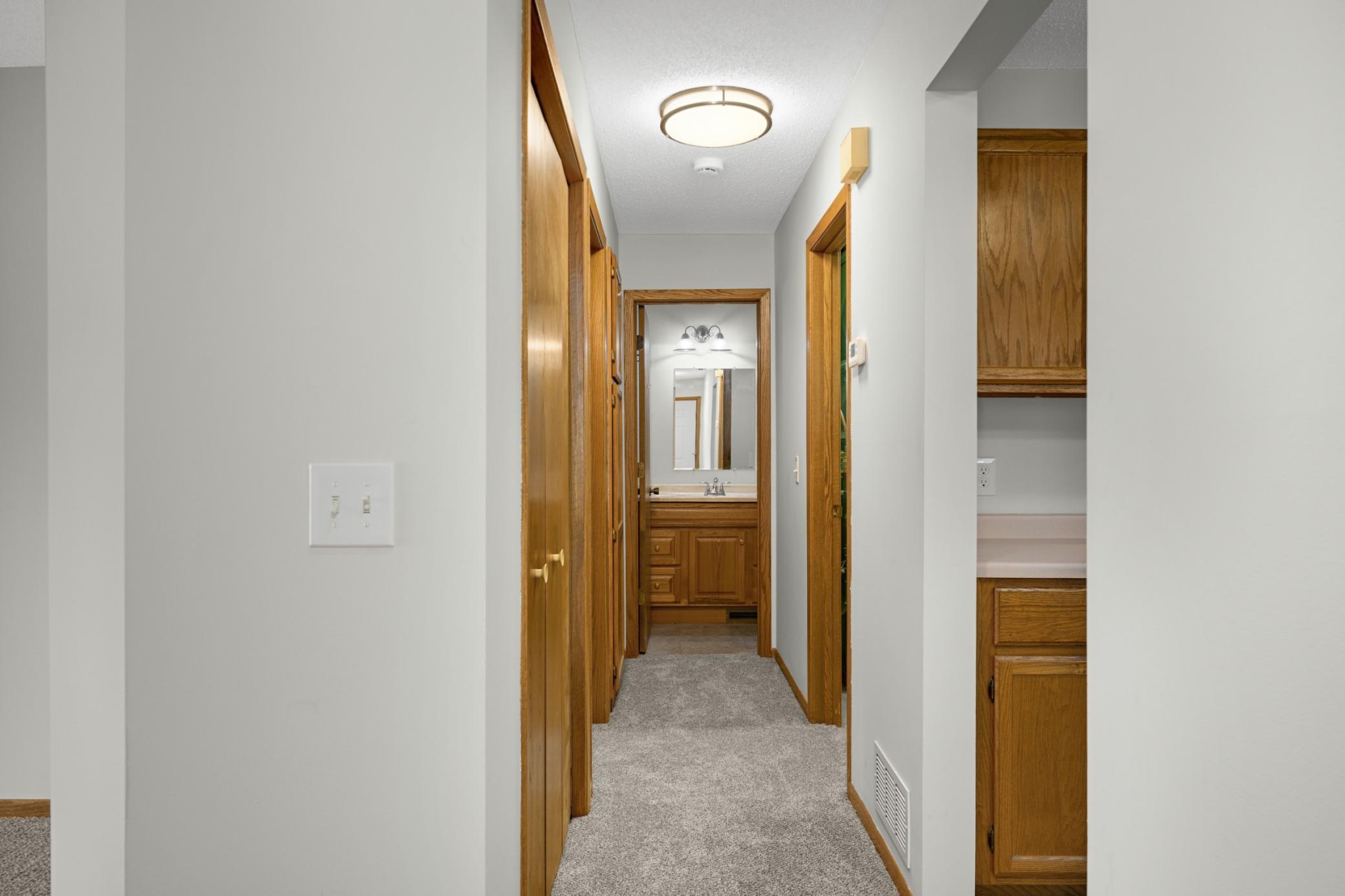Hallway to bedroom, bathroom and your own in-unit laundry room