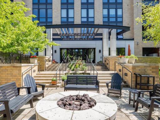 The Grand courtyard includes a gas fire pit for those cool evenings, gas grills, and seating area for outdoor dining. View facing the rear of the building.
