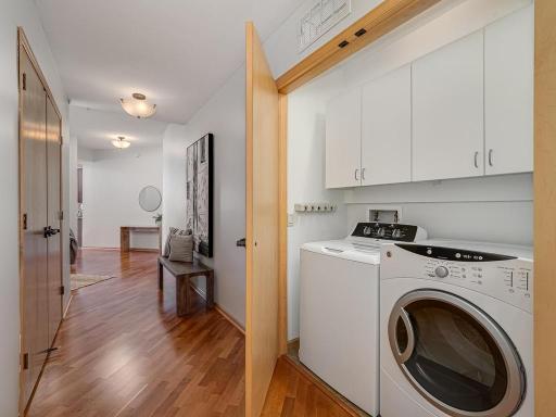 The entry hallway laundry area features a full size washer and dryer.