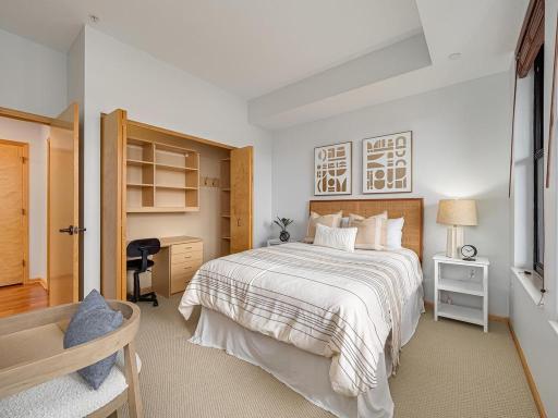 The second bedroom closet is equipped with a custom closet system.