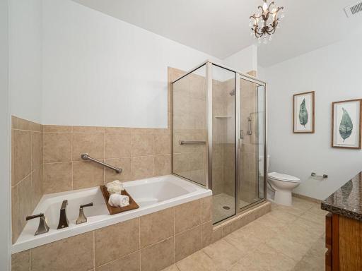 Separate soaking tub and walk-in shower.