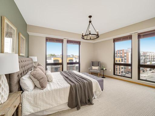 The expansive, corner primary bedroom offers large windows that face south and west providing sunlight through out the day. The bedroom easily accommodating a king size bed, dresser and/or seating area.