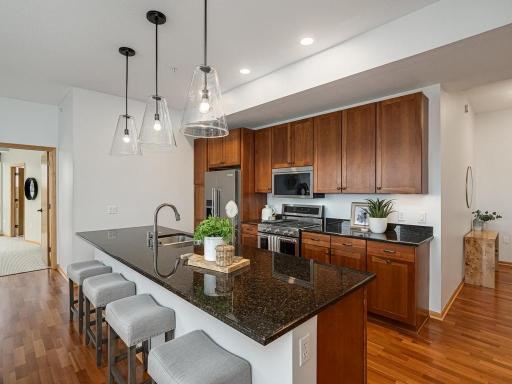 The kitchen features upgraded KitchenAid appliances: gas range, dishwasher and refrigerator.