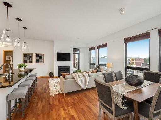 ABSOLUTELY STUNNING! Welcome to this amazing, 4th floor, SW corner, sun-filled 2 bedroom plus den condominium located in The Grand Condominiums at Excelsior & Grand in St. Louis Park