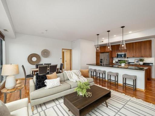 The open floor plan is an entertainer's dream allowing for a seamless flow between the living, dining and kitchen areas.