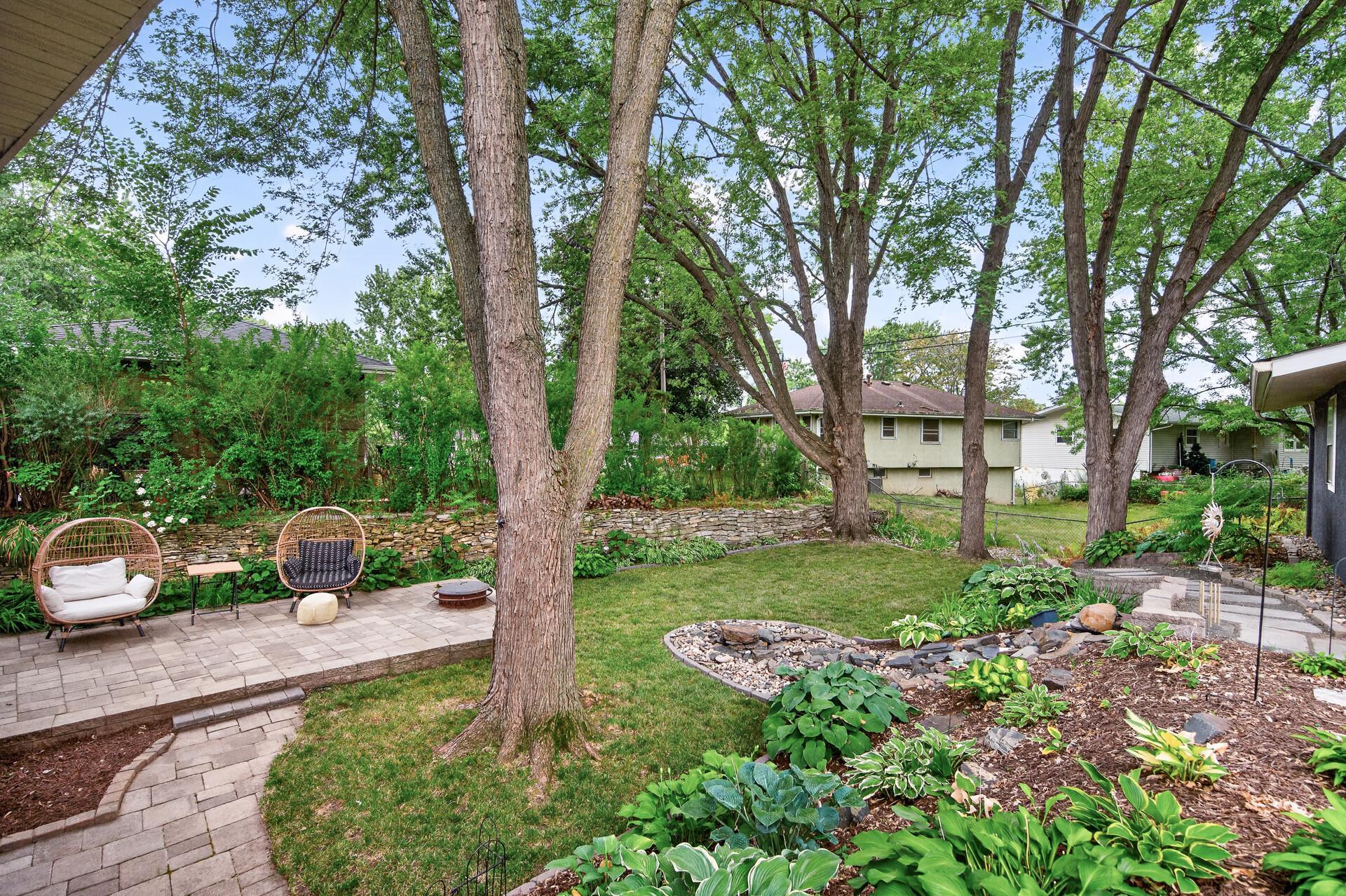 Impressive backyard oasis, complete with a waterfall feature.