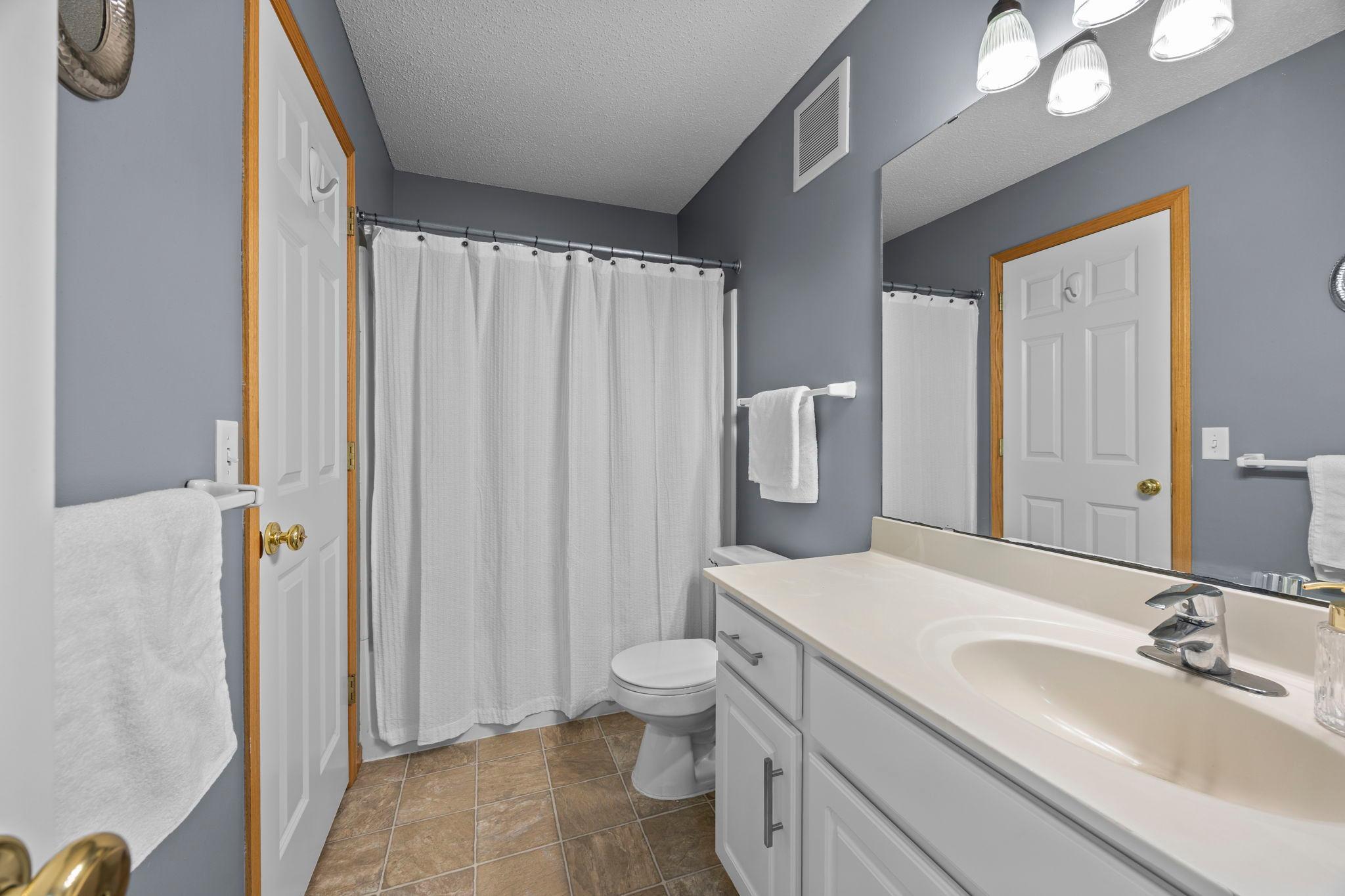 Convenient walk-through access to the full bathroom.