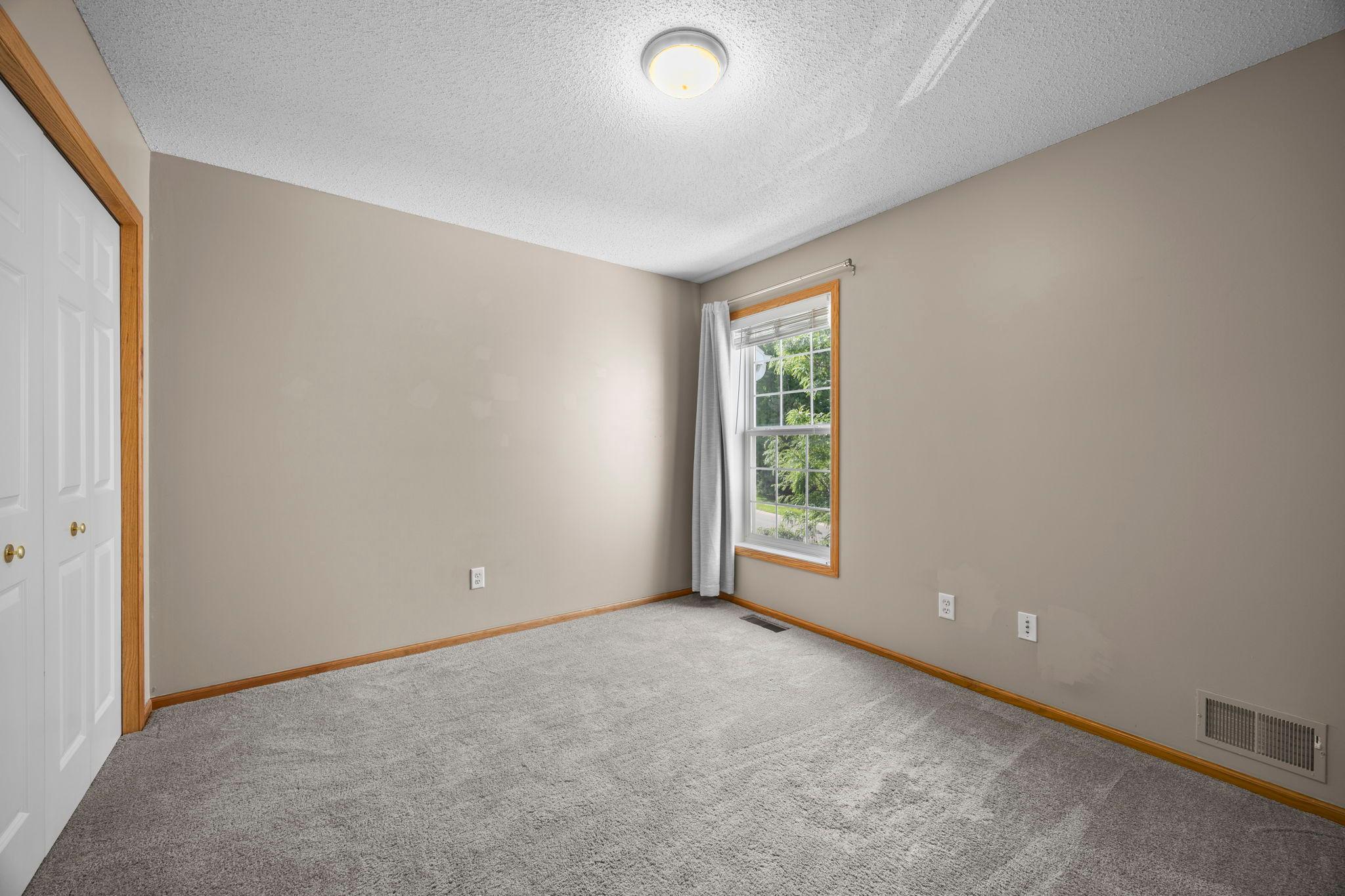 Second well-sized, upper-level bedroom.