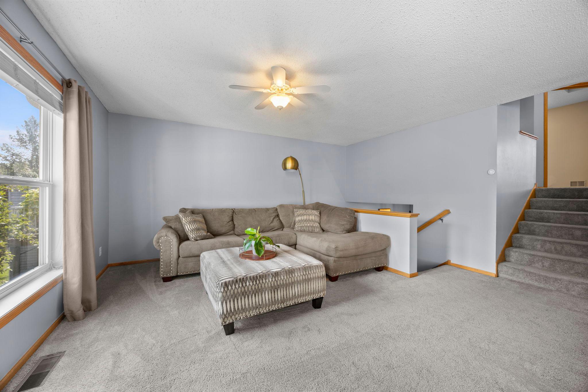 The main level welcomes you with an open floor plan filled with natural light.