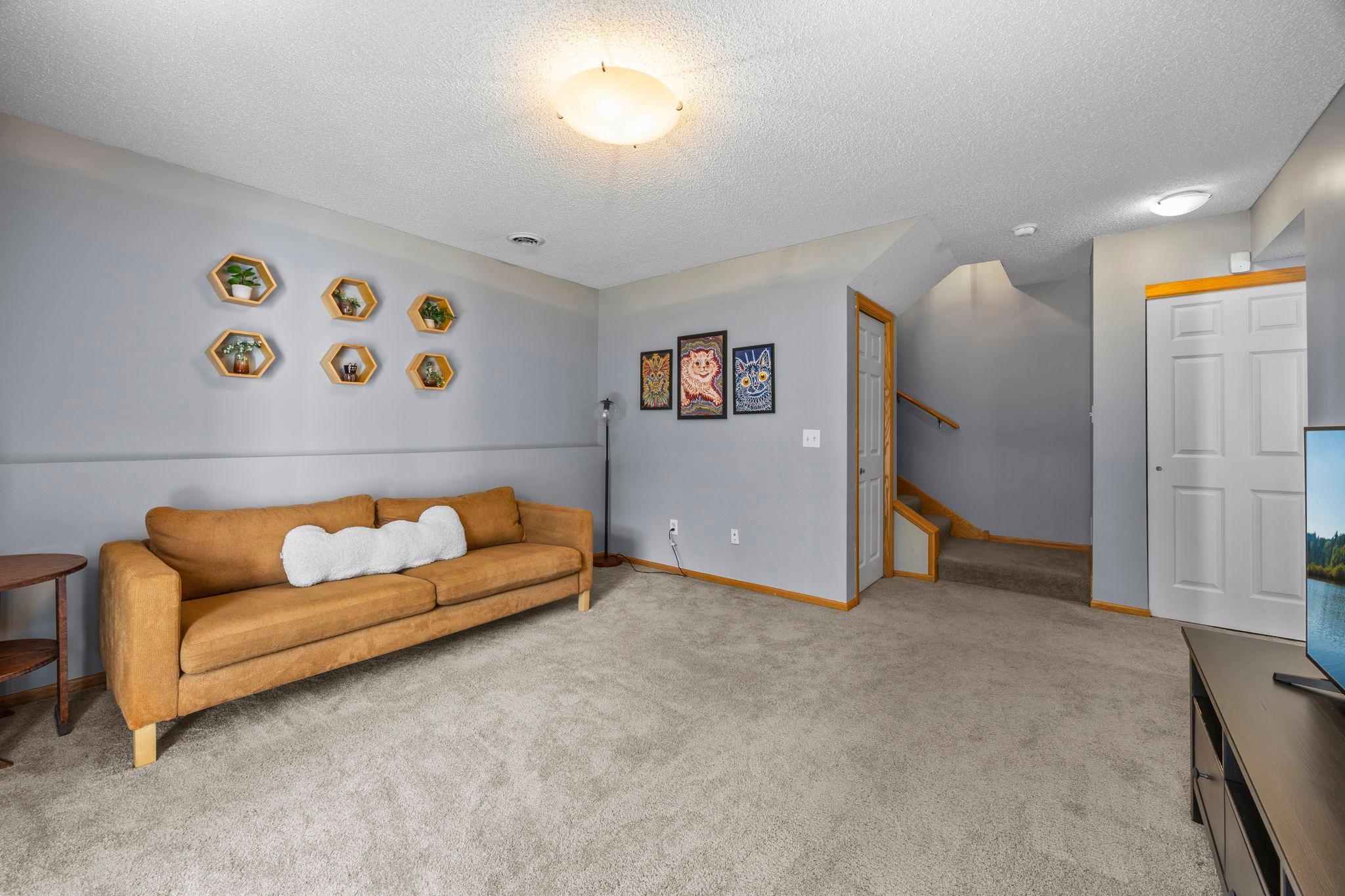 Spacious family room that walks out to a private patio through sliding glass doors.