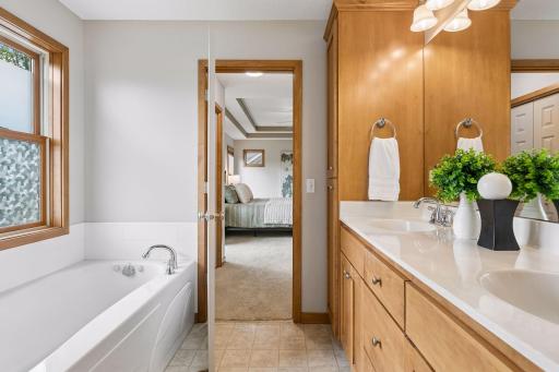 Double sinks, tub and walk in shower