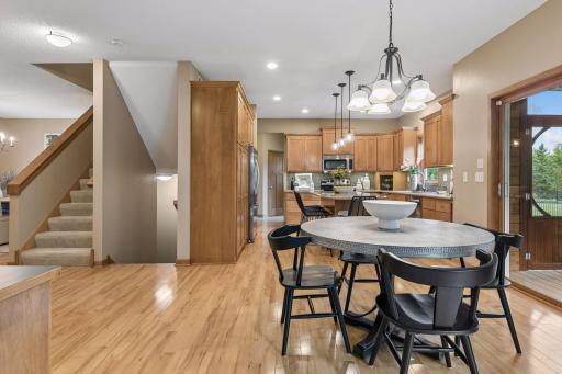 Eat in kitchen area opens to kitchen and screened porch