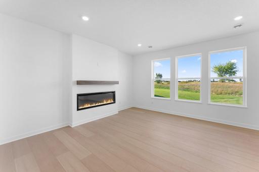 Located at the back of the home, the Great Room is perfect for cozy movie nights and entertaining alike with large windows to brighten up the space