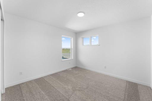 All the bedrooms in the home include a generously sized closet for wardrobe storage and wall-to-wall carpeting.