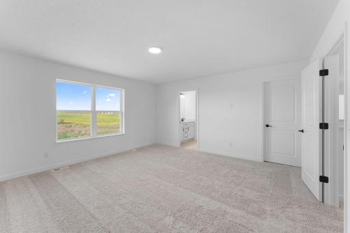 A peaceful hideaway, the owner’s suite enjoys the largest bedroom in the home to provide restful nights of sleep. It is complemented by a private bathroom and an oversized walk-in closet.