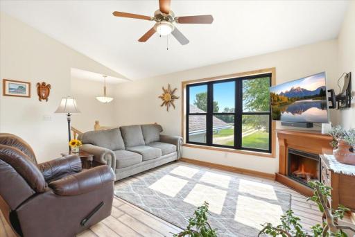 One of two inviting family gathering spaces in the home, this room showcases one of eight newly installed Andersen windows, filling the space with ribbons of natural light and cool breezes. A ceiling fan adds gentle air circulation and comfort.
