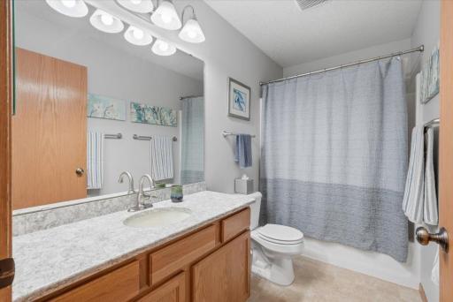 Full bath with nice lighting.