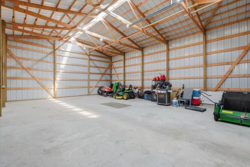 Newly constructed in 2020, this impressive 30' x 40' auxiliary building offers exceptional versatility and functionality. Features include a durable concrete floor, electrical panel, ample lighting, and a dedicated 30-amp electrical connection for RV