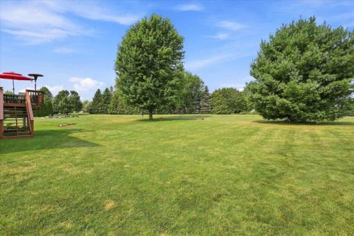 The park-like yard offers plenty of open space for lawn games, beautifully interspersed with mature trees that transform into a spectacular tapestry of color each fall.