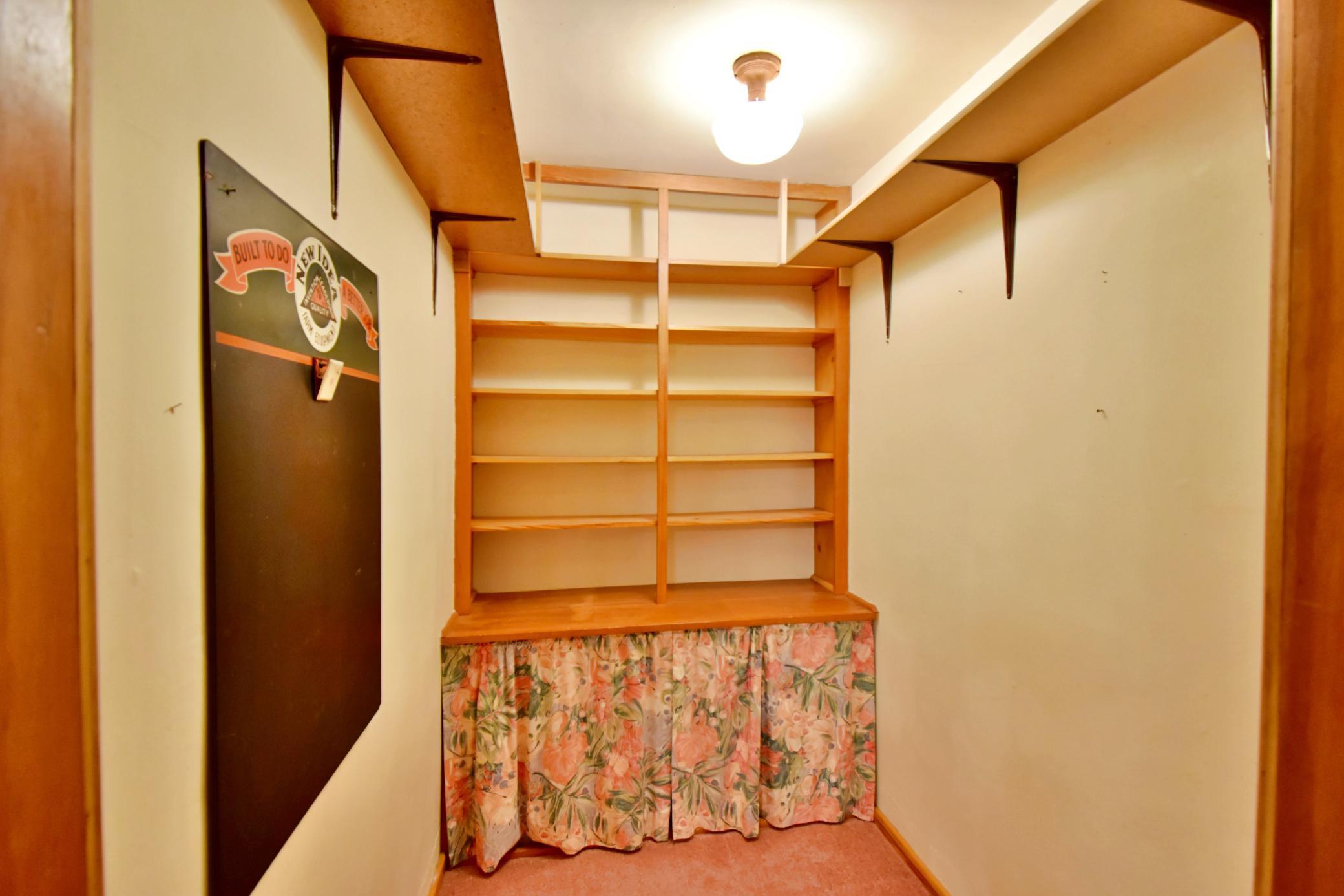 Small room just next to the dining room to hold your serving dishes or could be used as a pantry area!