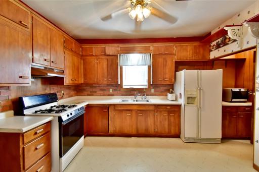 Kitchen has ample cupboards and counter area for family meals and entertaining