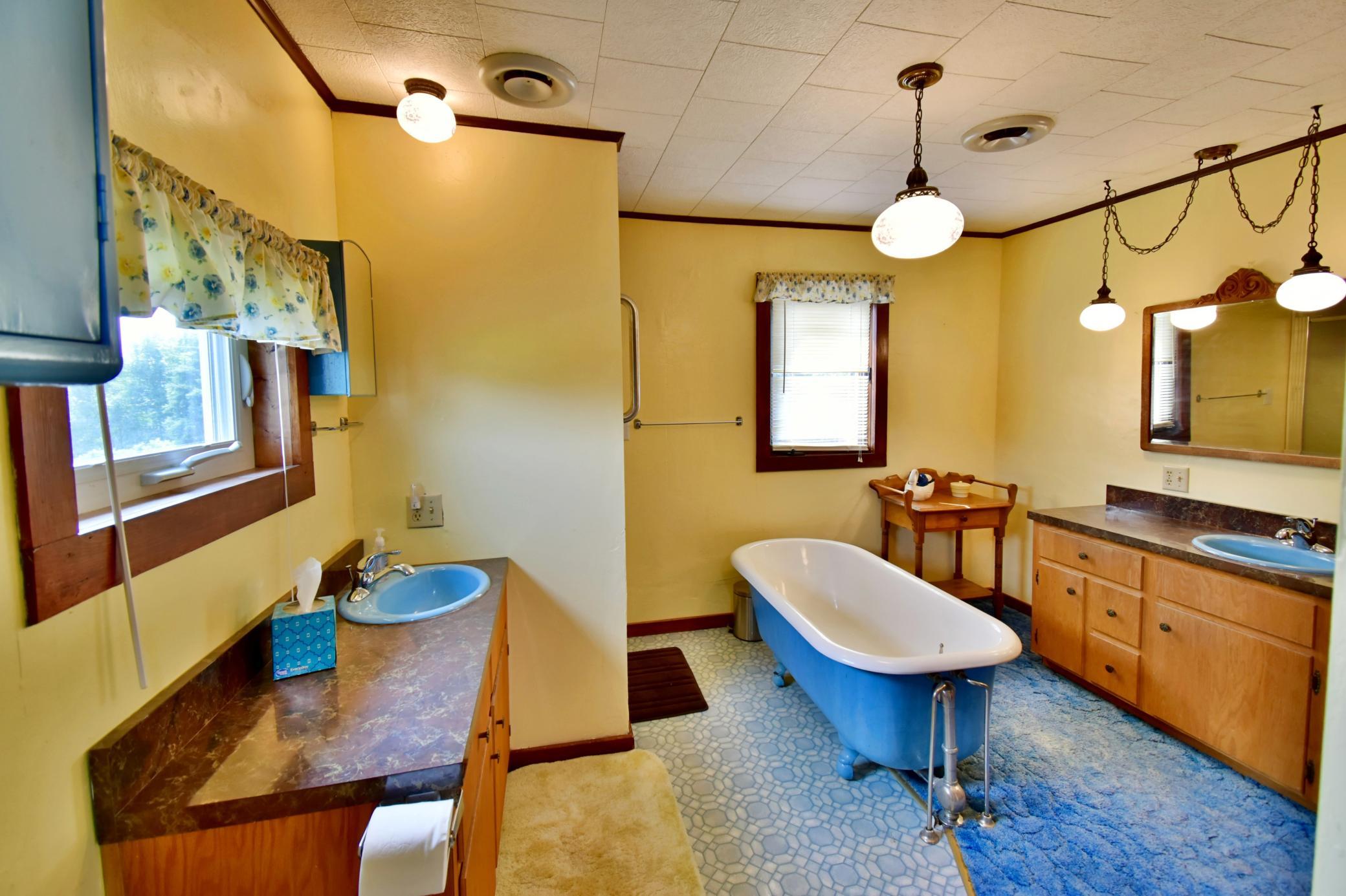 Upper level full bathroom is very large and has two vanity areas