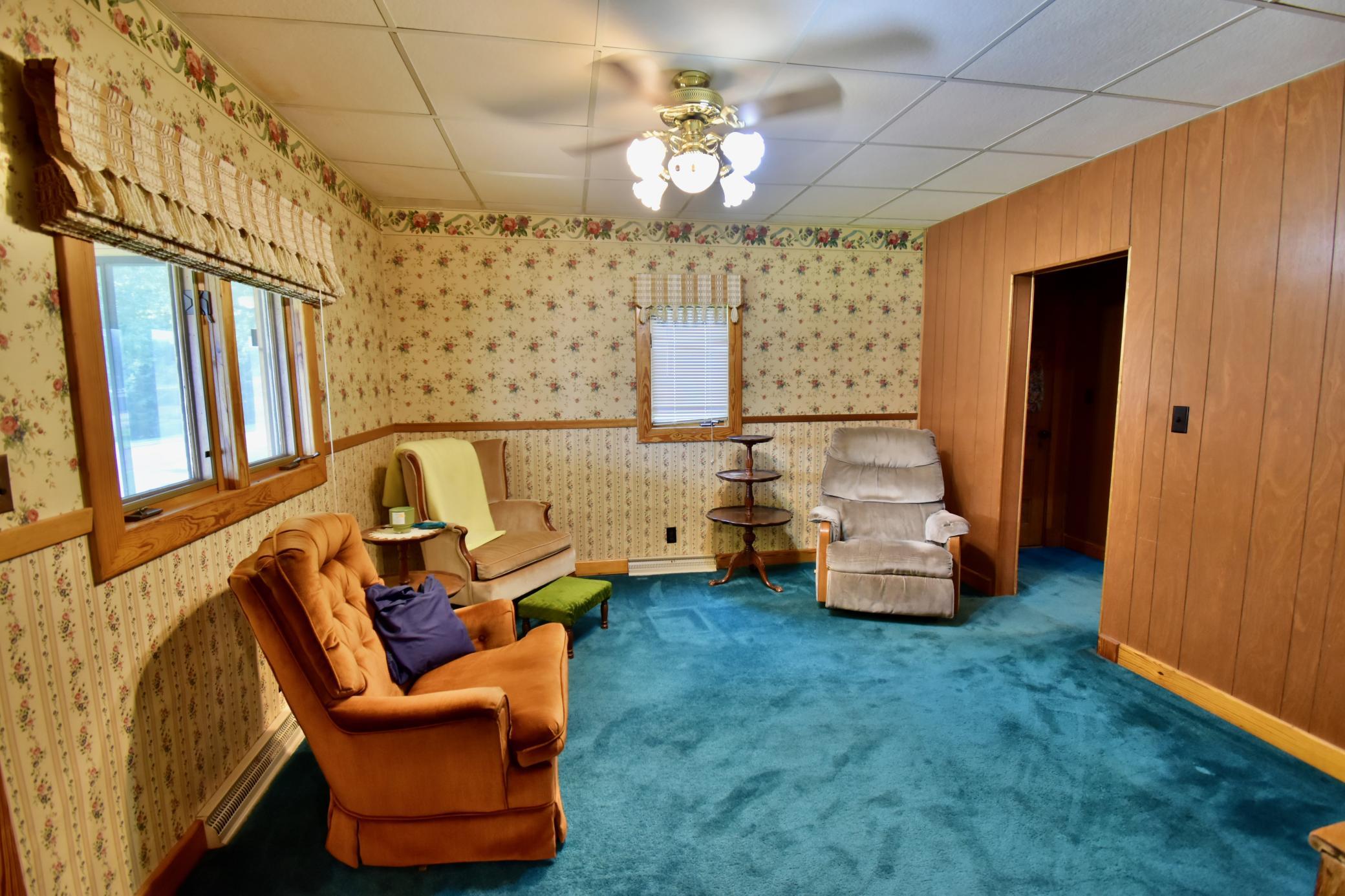 Living room area is between the dining room and office area
