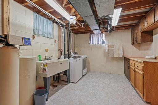 Clean laundry room with bonus extra cabinets