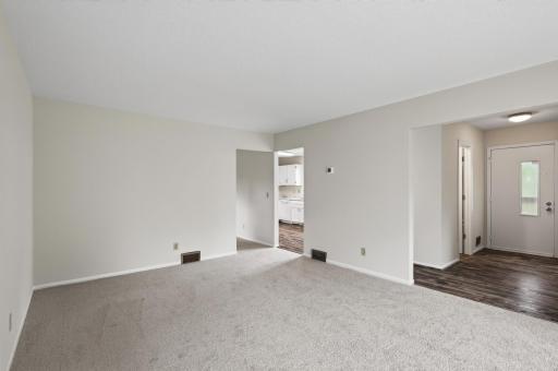 Spacious main-level living room filled with natural light