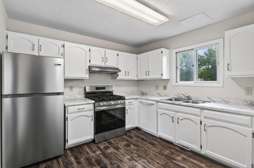 Updated kitchen with brand-new stainless steel appliances and new countertops