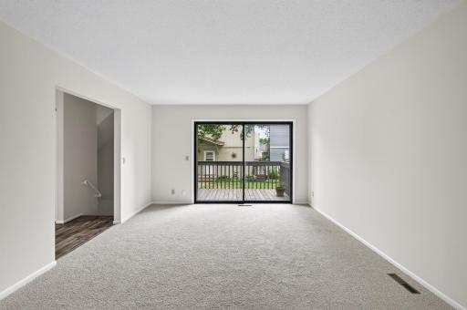Spacious main-level living room filled with natural light