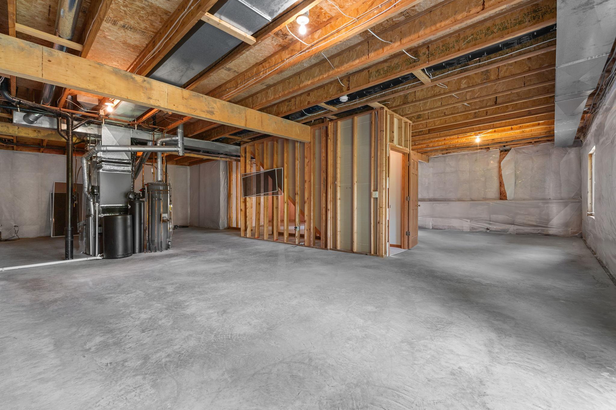 Incredible unfinished space ready for a future family room, bedrooms, hobby area, or more.