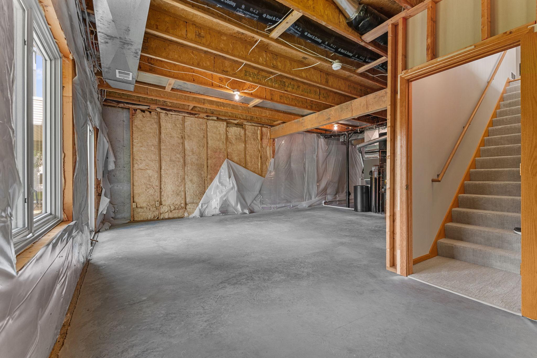 Expansive unfinished lower level offers additional square feet with endless possibilities.