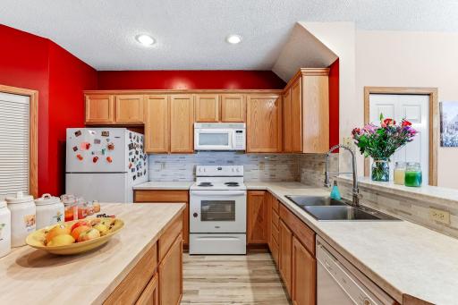 Kitchen with newer flooring, newer appliances