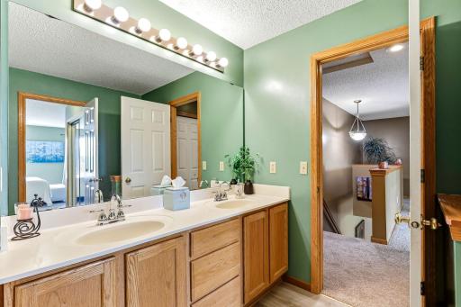 Upper walkthrough bathroom with double vanities