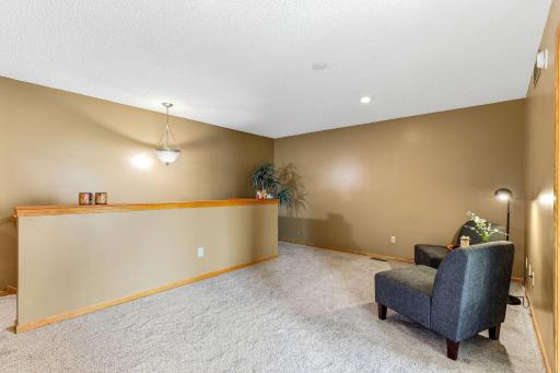 a versatile loft, perfect for a home office, entertainment area, or additional living space