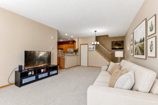 Newer carpet throughout the house (this photo contains digital staging elements)