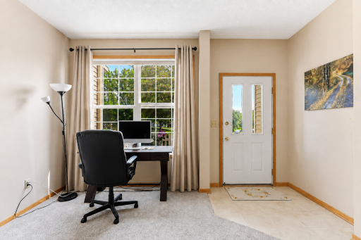 Newer carpet throughout the house -front entry (this photo contains digital staging elements)