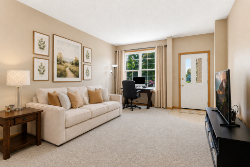 Newer carpet throughout the house- Living area (this photo contains digital staging elements)