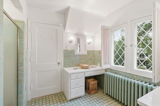 Fairy tale primary bath with amazing title, window with natural light! Newly updated vanities!