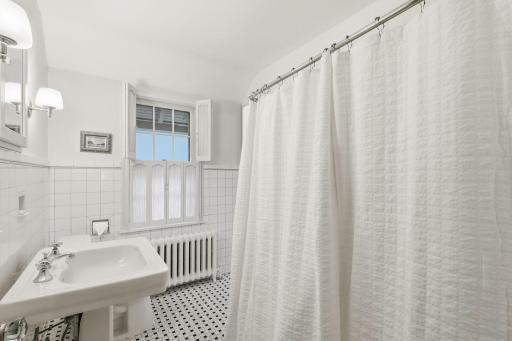 Clean efficient 2nd upstairs bathroom with circular access from Bedroom 4 and 2nd floor landing.
