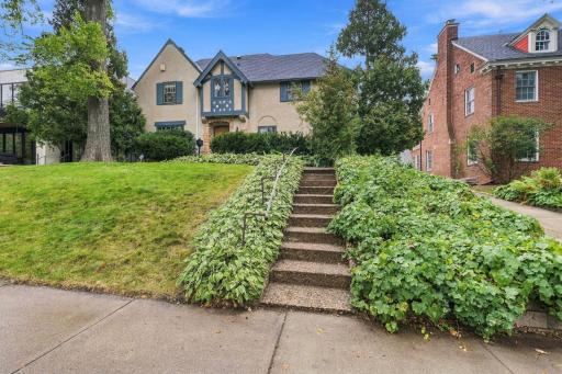 This magical Tudor Revival home is perched high in Linden Hills with a view of Bde Maka Ska.