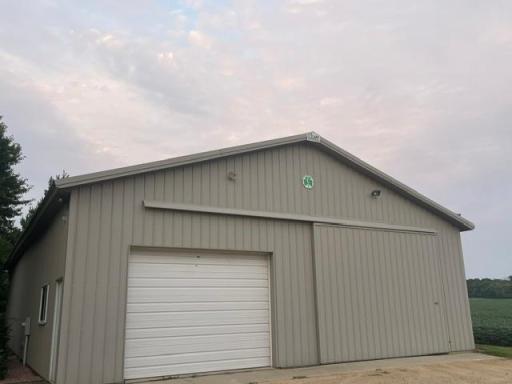 12' ceilings in the pole barn. 16' sliding door, plus overhead door to finished shop. 2 service doors.